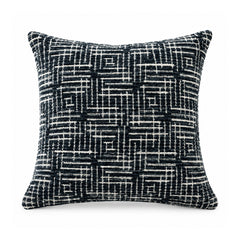 Primeval black and white geometric cushion cover showing an intricate all-over abstract linear maze pattern