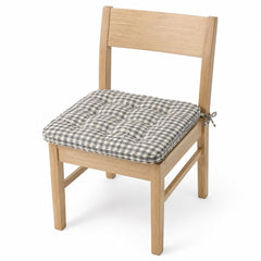 Primeval black and white gingham dining chair pad with tie straps on wooden dining chair