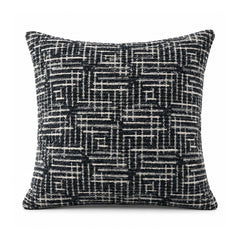 Primeval black and ivory cushion cover with an intricate crosshatched linear grid and interlocking maze-like geometric pattern