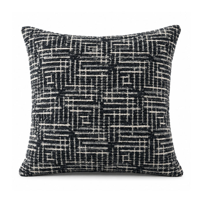 Primeval black and ivory cushion cover with an intricate crosshatched linear grid and interlocking maze-like geometric pattern