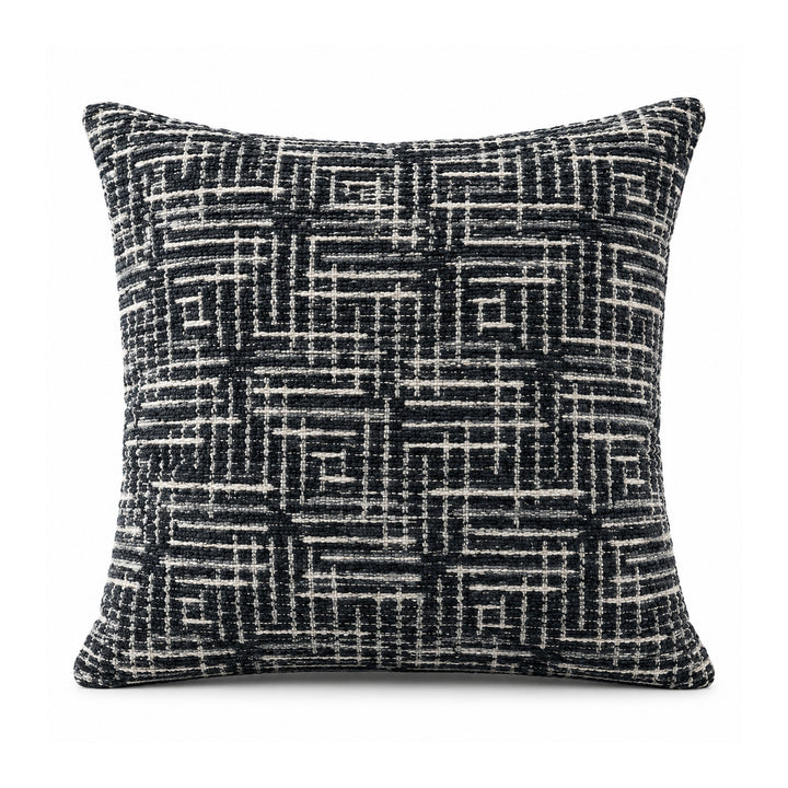 Primeval black and ivory cushion cover with an intricate crosshatched linear grid and interlocking maze-like geometric pattern