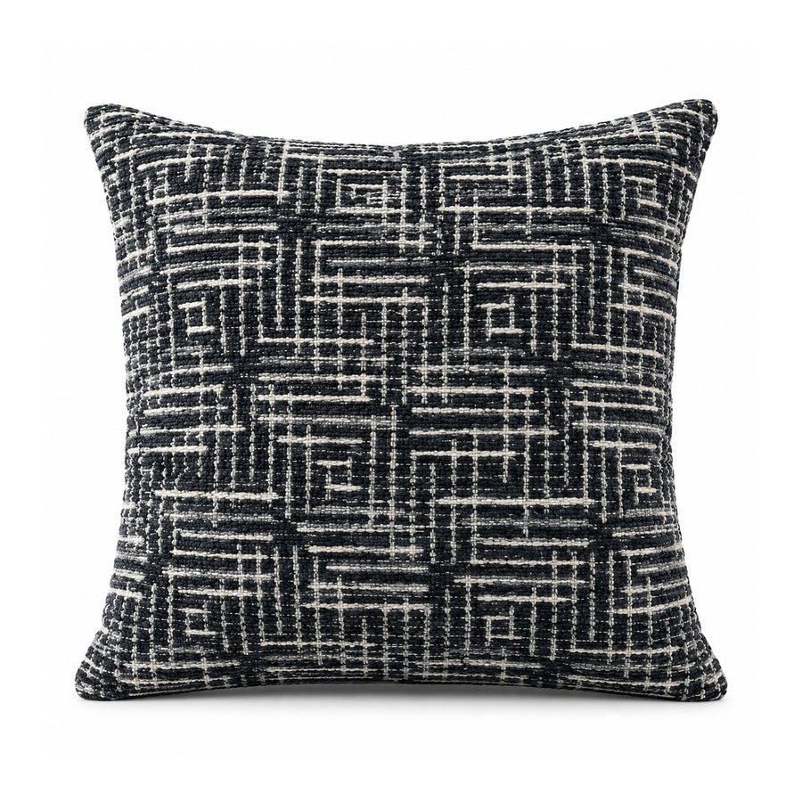 Primeval black and ivory cushion cover with an intricate crosshatched linear grid and interlocking maze-like geometric pattern