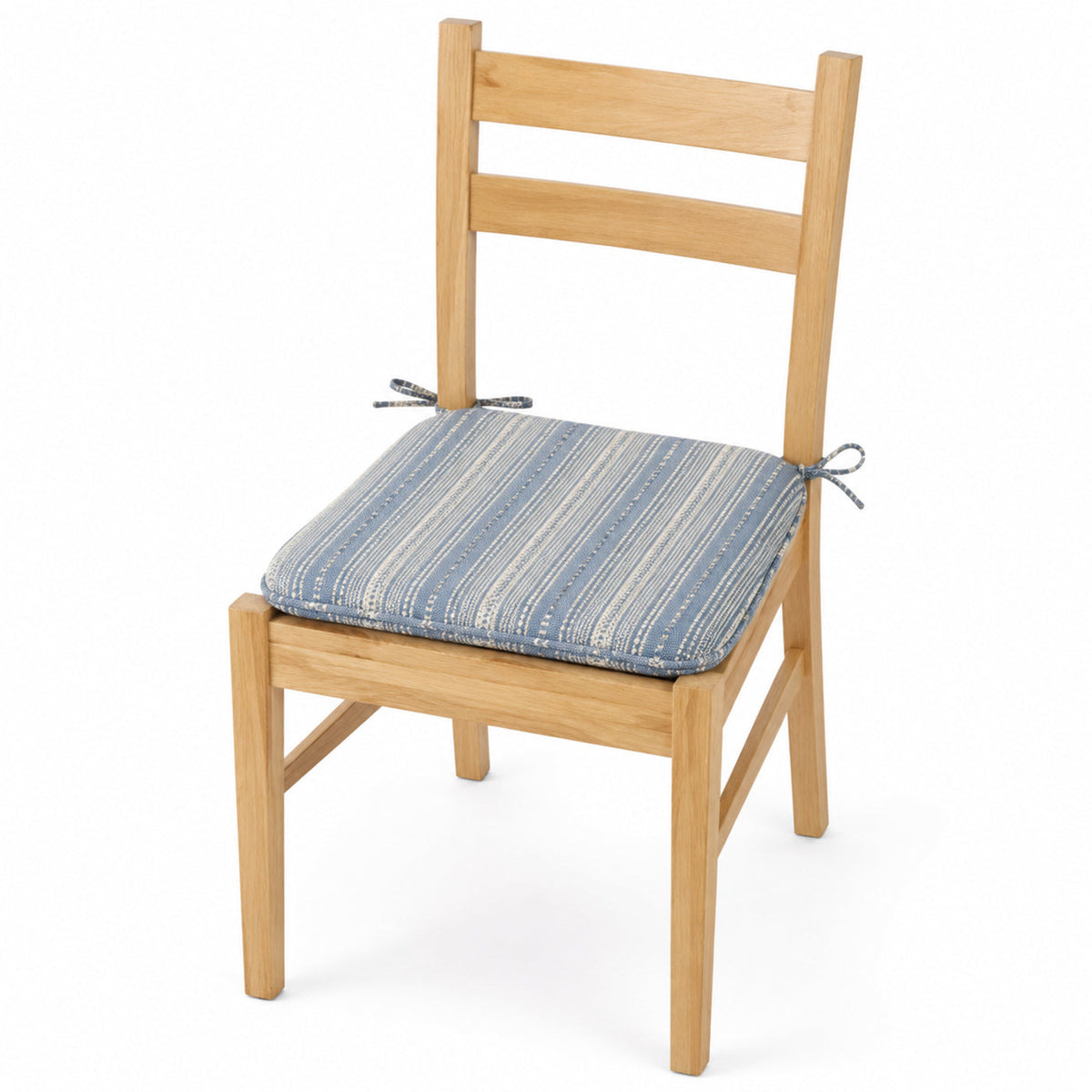 Primeval blue striped dining chair pad with tie straps on wooden dining chair