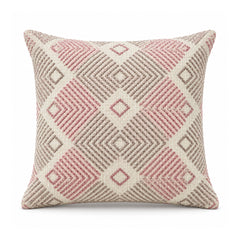 Primeval decorative throw cushion with blush pink and gray diamond chevron pattern on an ivory background, shown against a white background