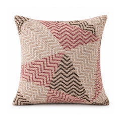Primeval blush pink rose and charcoal cushion with layered zigzag chevron patchwork motifs