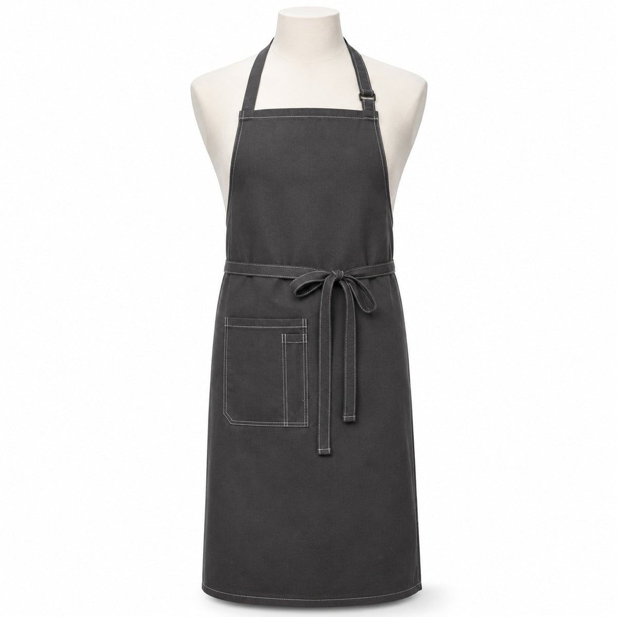 Primeval charcoal utility chef apron with contrast stitching and front pockets displayed on a dress form
