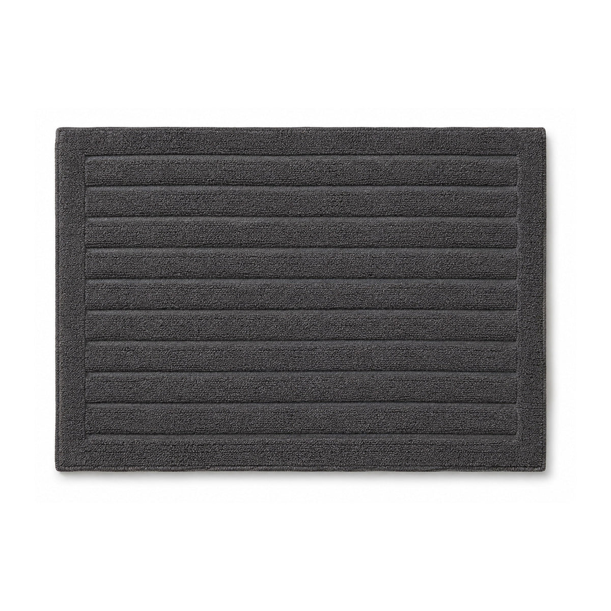 Charcoal grey ribbed bath rug with horizontal stripes on white background