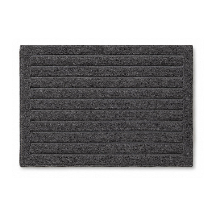 Charcoal grey ribbed bath rug with horizontal stripes on white background