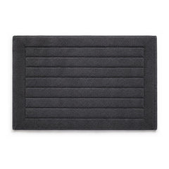 Charcoal grey striped textured bath mat on white background