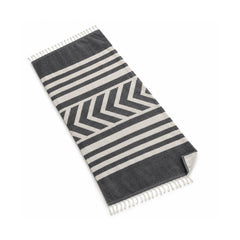 Charcoal and ivory beach towel with a tribal chevron geometric pattern.
