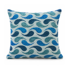 Primeval cobalt blue and aqua cushion with a bold repeating wavy S-curve pattern on light ivory