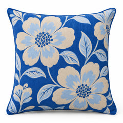 Cobalt blue decorative cushion cover with large ivory and pale blue floral pattern