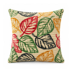 Primeval decorative throw cushion with orange, coral, mustard, olive and black botanical leaves on an ivory background