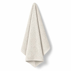 Cream arch tufted cotton bath towel 70x140 cm on white background