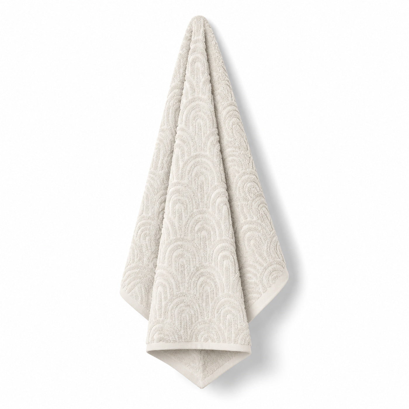 Cream arch tufted cotton bath towel 70x140 cm on white background