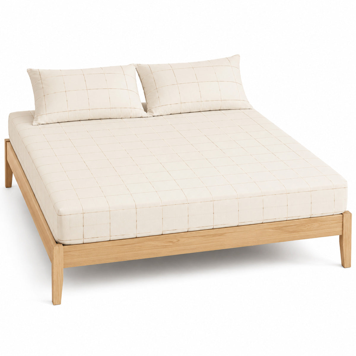 Cream and beige windowpane bed sheet set with matching pillowcases on a wooden bed