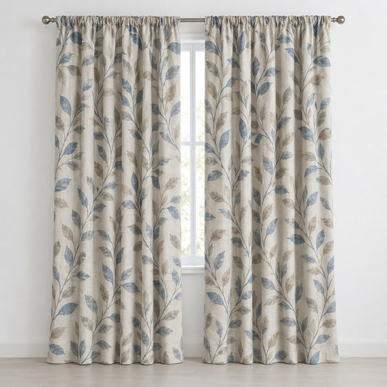 Cream blackout curtains with blue leaf print, front product view - Primeval