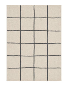 Cream and charcoal loop-pile area rug with a soft oversized grid pattern on a white background.
