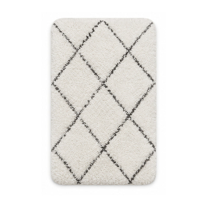 Cream shag bath mat with charcoal trellis pattern on white background