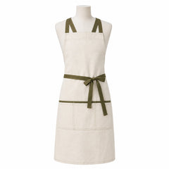 Primeval cream chef apron with olive cross-back straps and front pockets displayed on a dress form