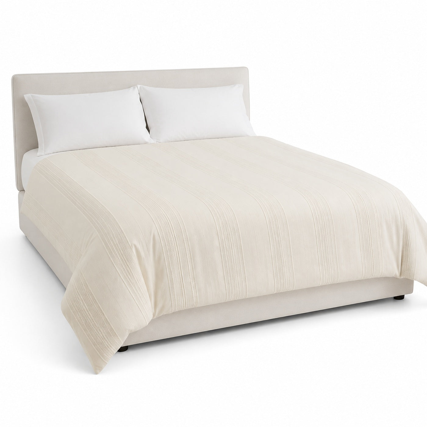 Primeval cream raised stripe duvet cover displayed on a styled bed against a clean white studio background