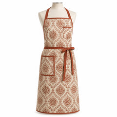 Primeval cream chef apron with rust artisan-style motifs displayed on a dress form