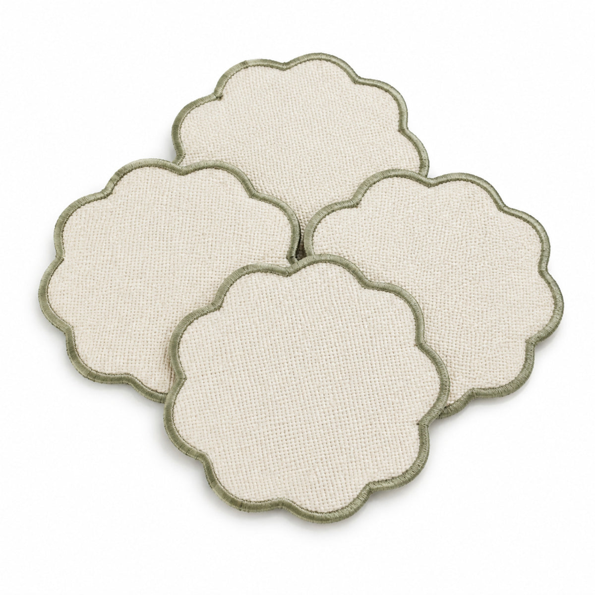 Cream scalloped coaster set with sage edge on a clean white background