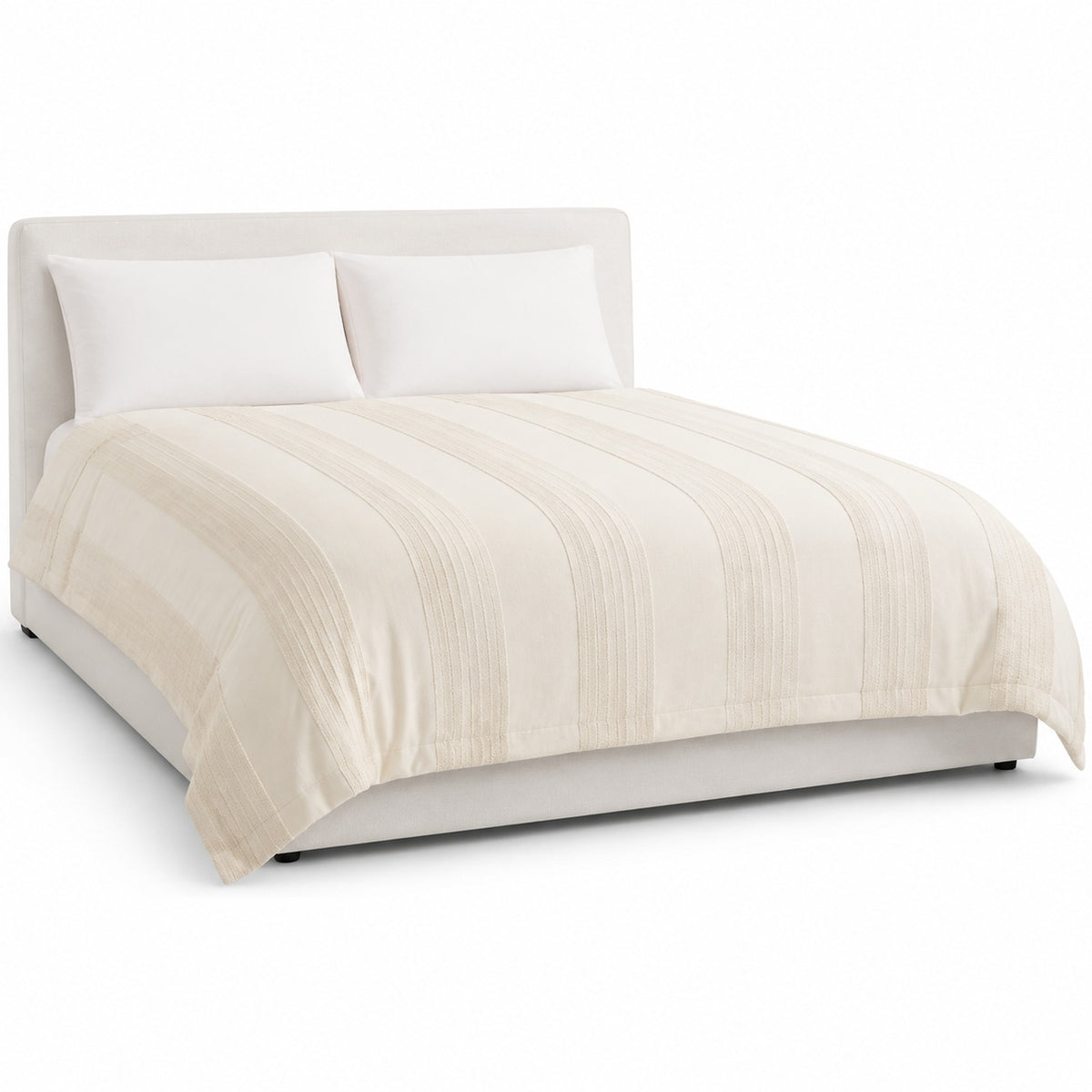 Primeval cream sculpted stripe duvet cover displayed on a styled bed against a clean white studio background