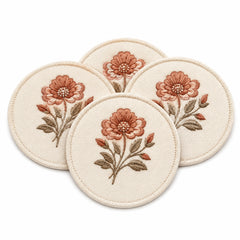 Cream terracotta floral coaster set on a clean white background