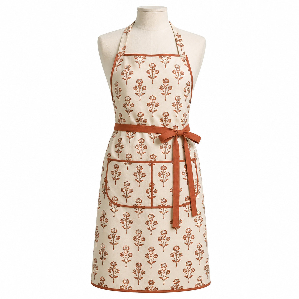 Primeval cream chef apron with terracotta floral print displayed on a dress form