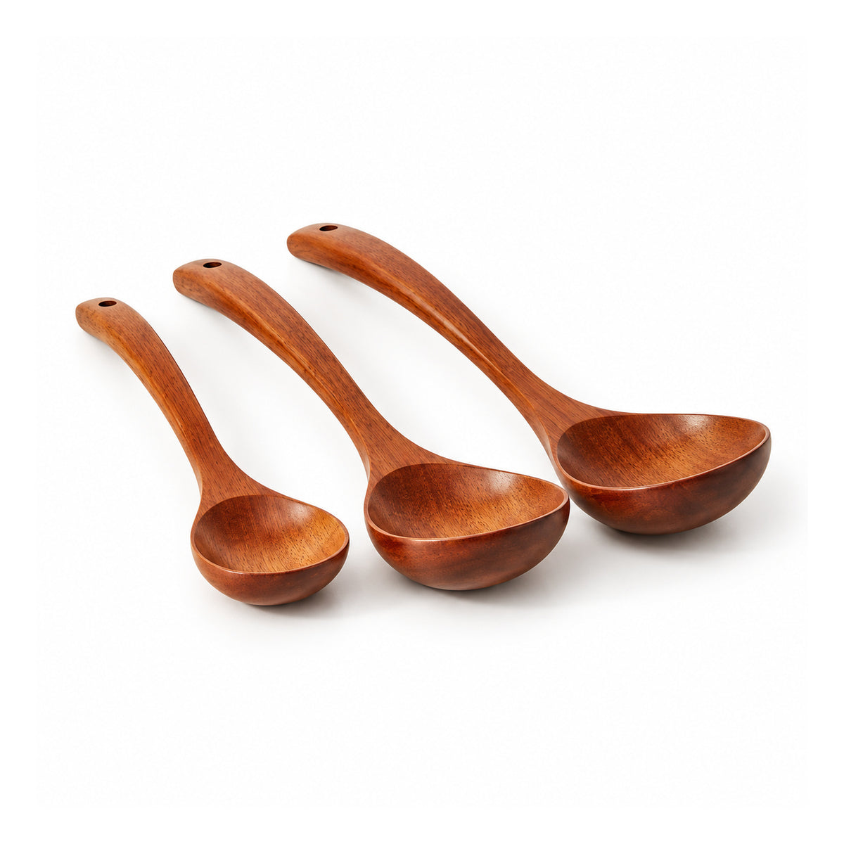 Three reddish-brown wooden ladles with curved long handles and rounded bowls in graduated sizes