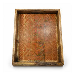 Deep rectangular wooden tray with raised rustic sides and engraved geometric patterned base in warm brown tones