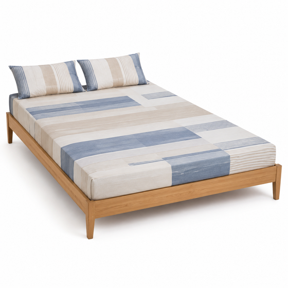 Dusty blue beige and ivory block-stripe bed sheet set with matching pillowcases on a wooden bed