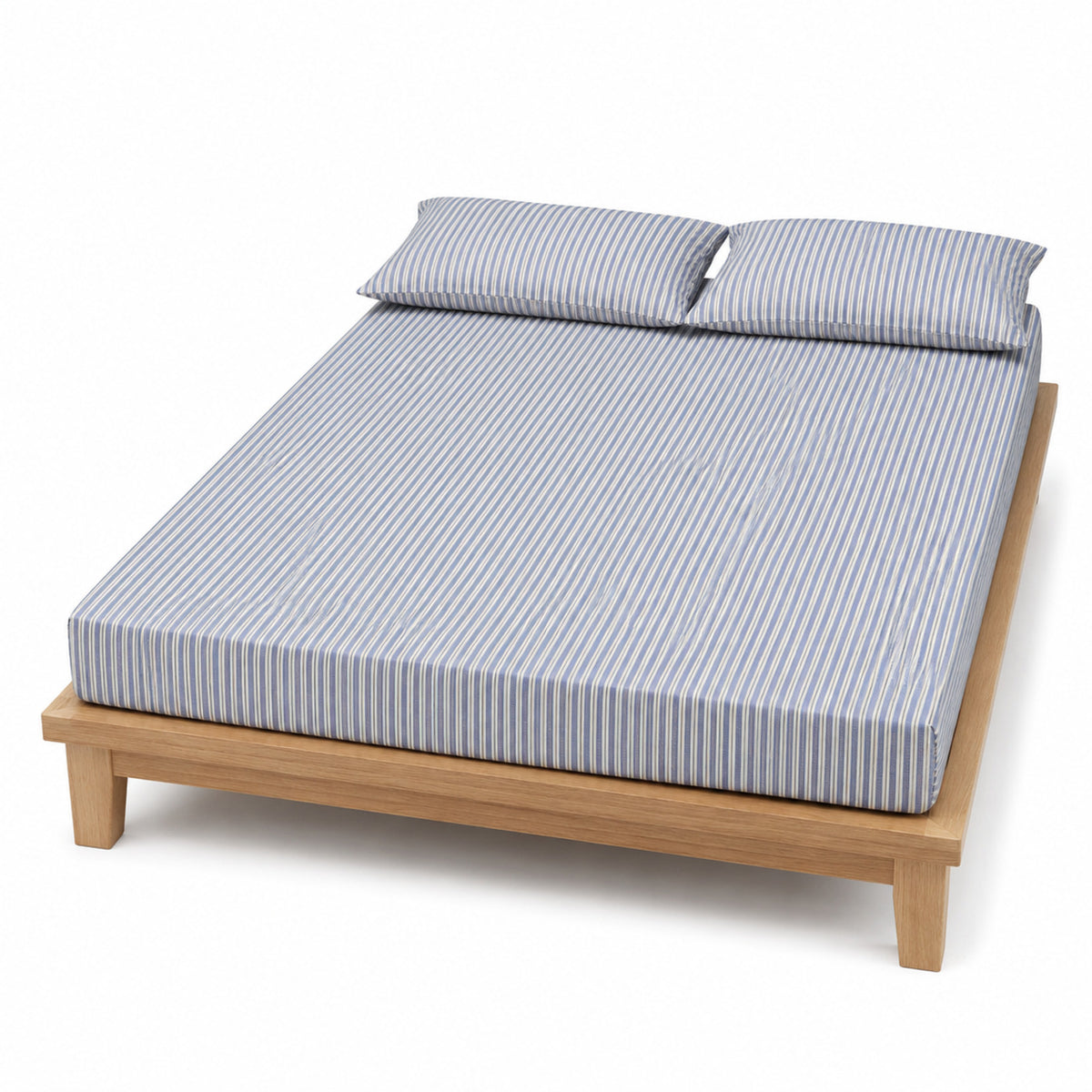 Dusty blue and cream stripe bed sheet set with matching pillowcases on a wooden bed