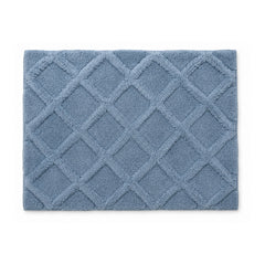 Dusty blue diamond lattice plush bath mat on white background