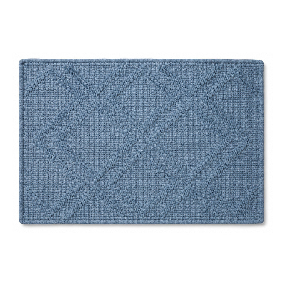 Dusty blue diamond textured bath mat on white background