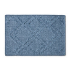 Dusty blue diamond textured bath mat on white background