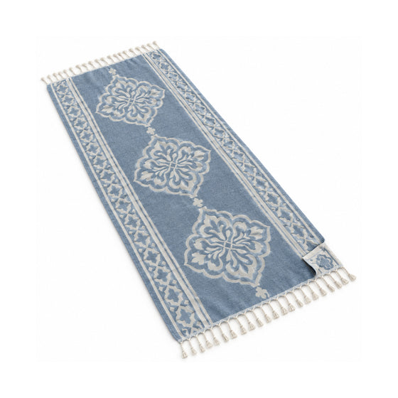 Dusty blue floral medallion fringed beach towel with an elegant ornamental pattern.