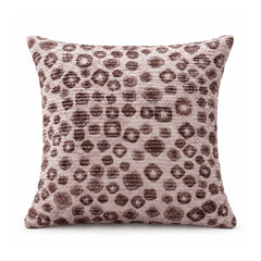 Primeval decorative throw cushion with dusty mauve and dark brown animal-inspired leopard spots