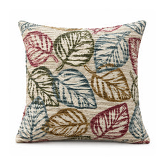 Primeval ivory botanical cushion cover with large outlined foliage in olive green, burgundy, ochre and slate blue