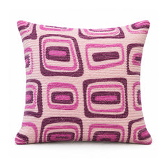 Primeval fuchsia magenta and pale pink cushion cover featuring a repeating rounded-rectangle retro geometric pattern