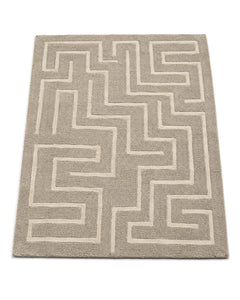 Greige and cream hand-tufted area rug with angular maze pattern on a white background.