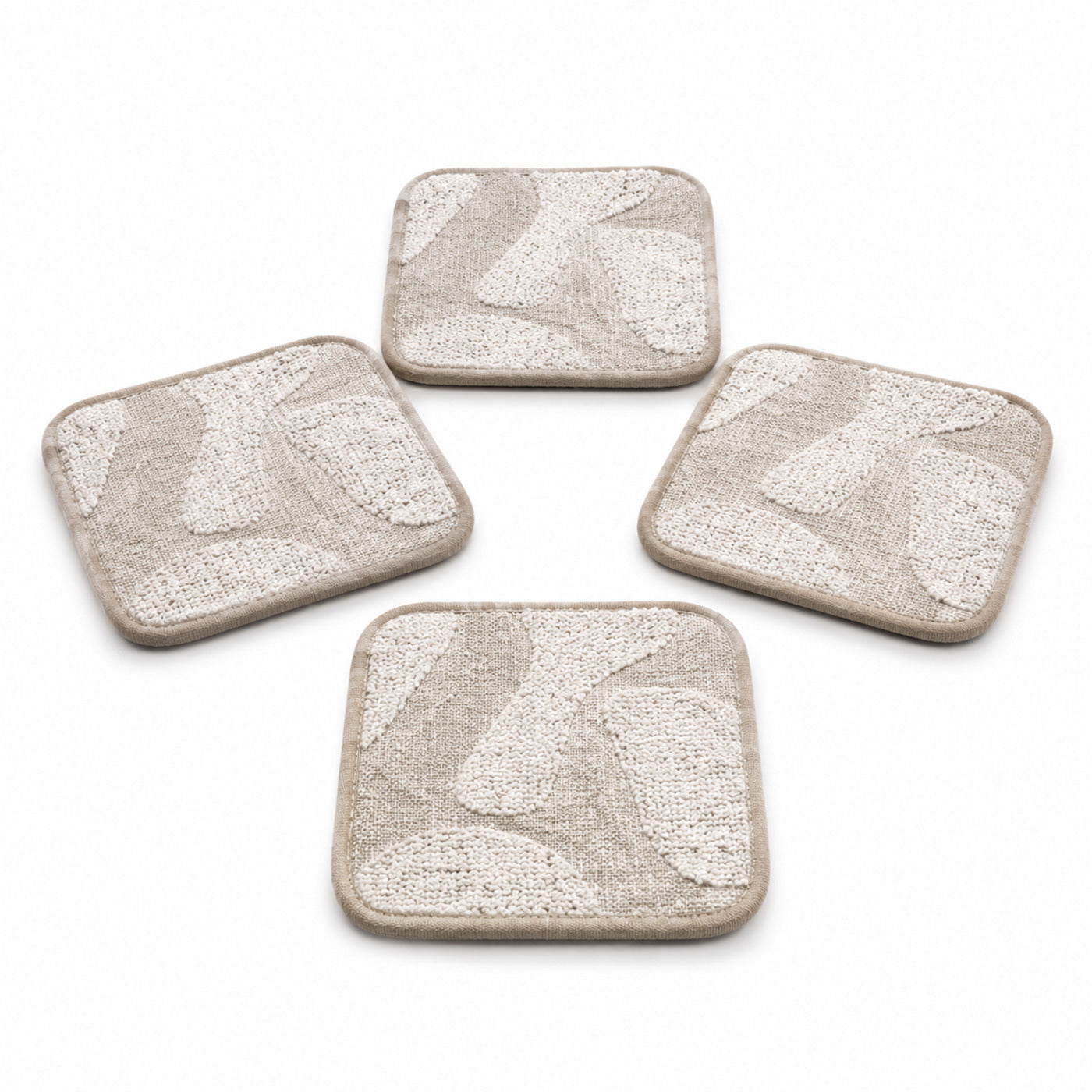 Greige ivory abstract textured coaster set on a clean white background