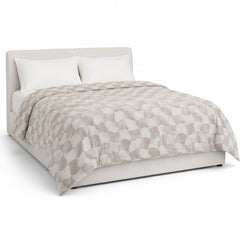 Primeval greige and ivory wavy checkerboard duvet cover displayed on a styled bed against a clean white studio background