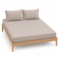 Greige tonal jacquard bed sheet set with matching pillowcases on a wooden bed