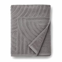 Grey abstract tufted cotton bath towel 70x140 cm on white background