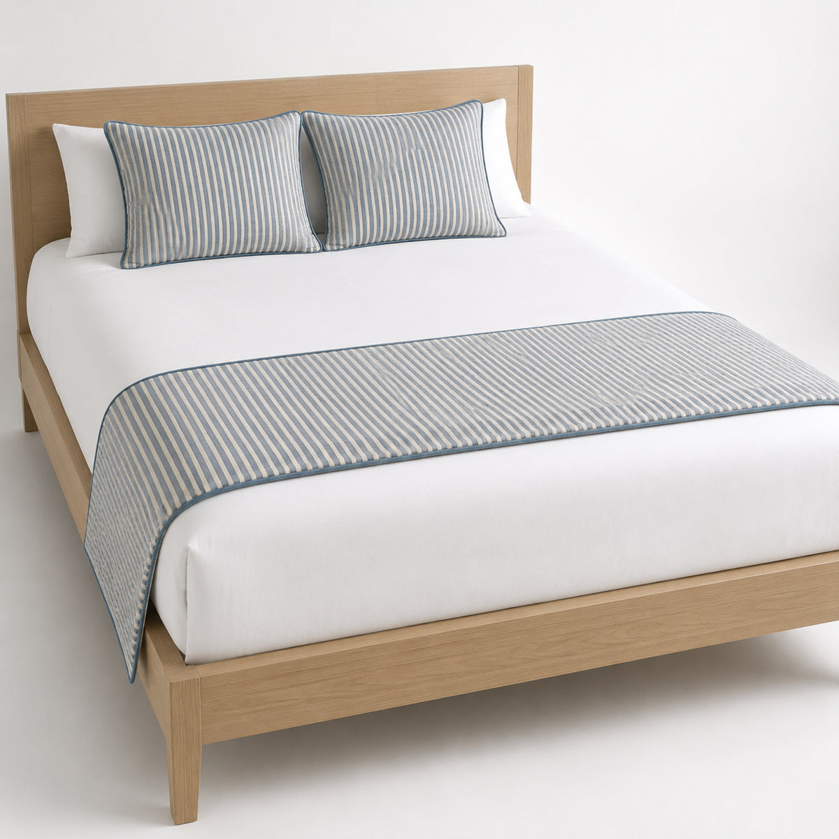 Grey fine-weave bed runner styled across white bedding for wholesale hotel, hospitality and private-label bedroom sourcing
