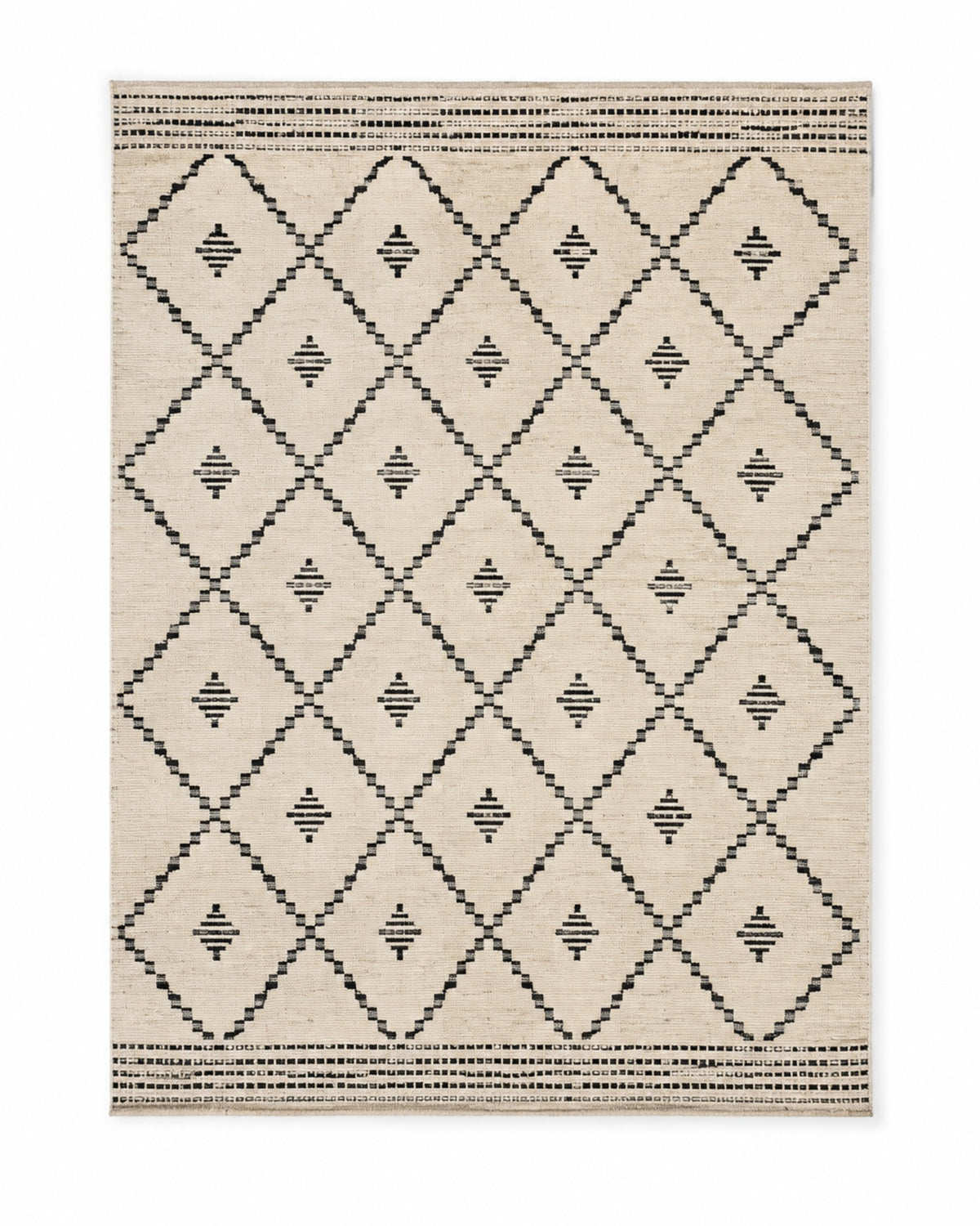 Black and ivory handwoven cotton rug with diamond tribal geometric pattern