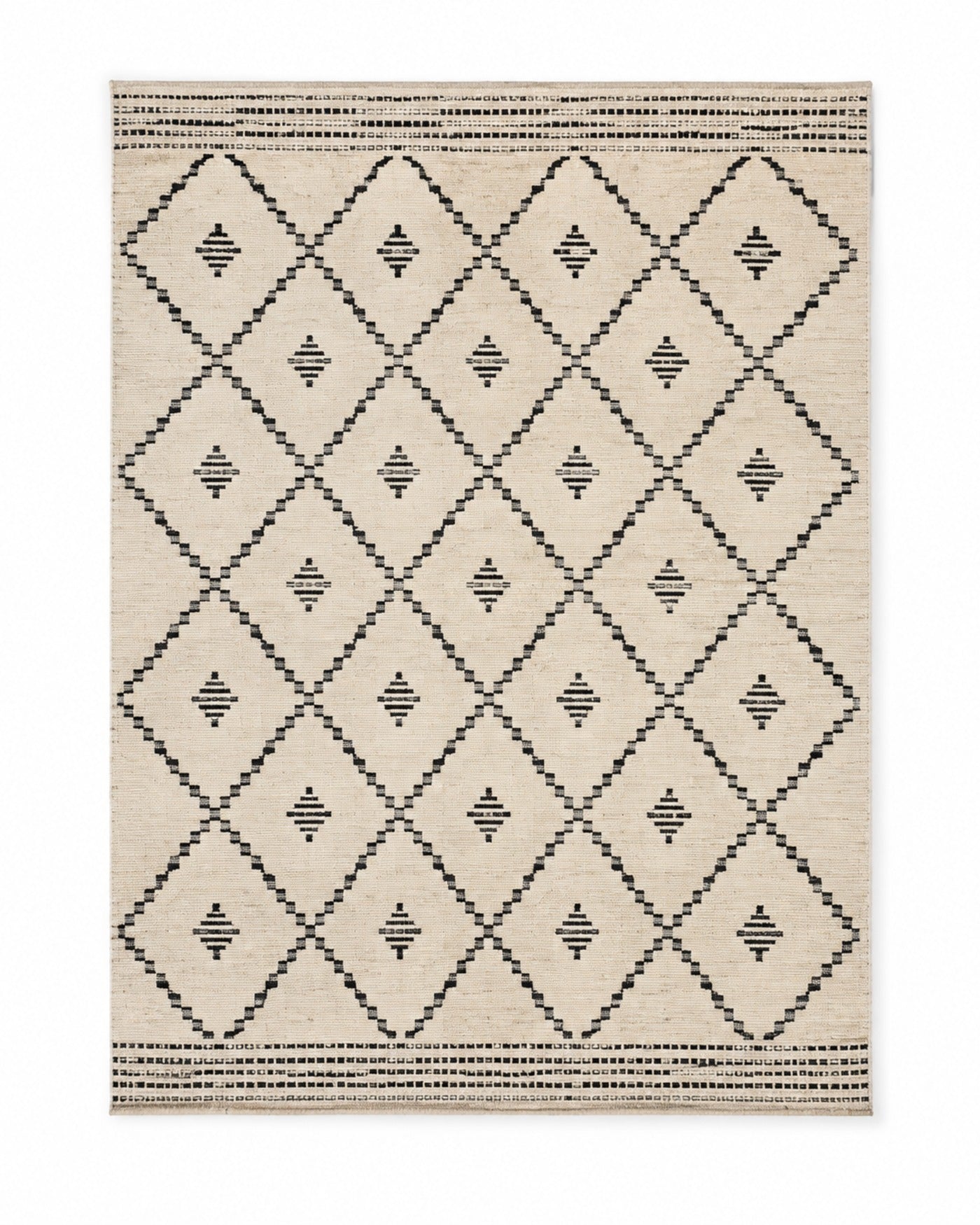 Black and ivory handwoven cotton rug with diamond tribal geometric pattern