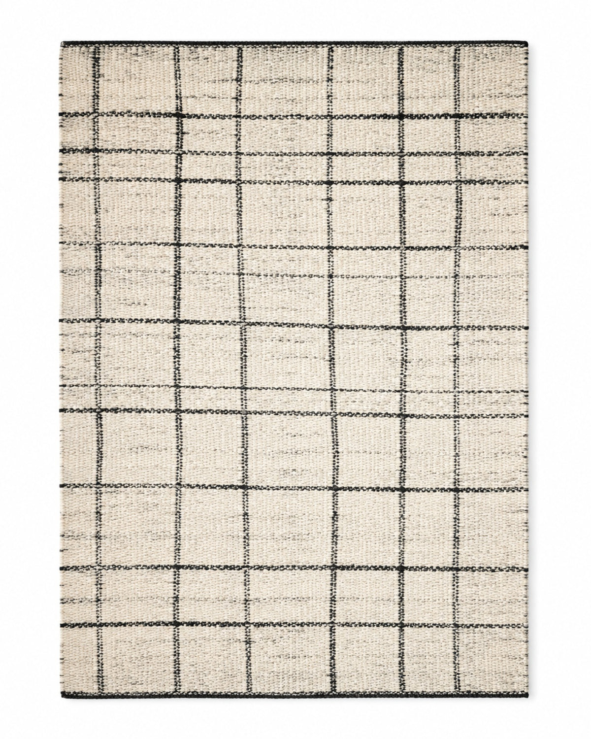 Black and ivory handwoven cotton rug with irregular windowpane grid pattern